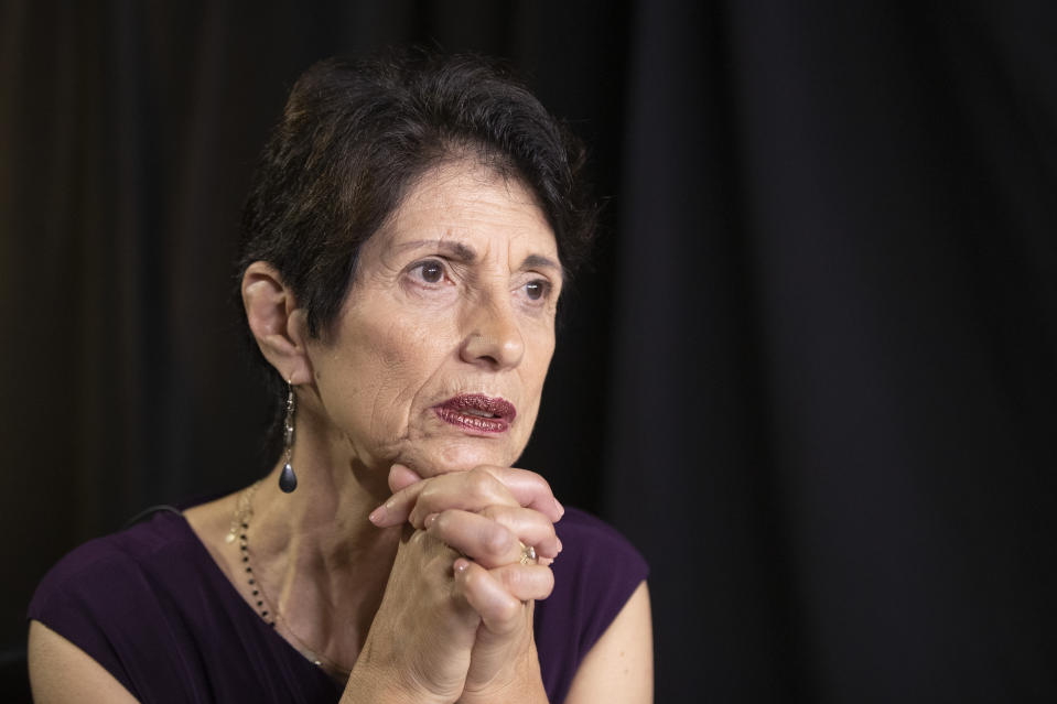 FILE - In this June 19, 2019, file photo, Diane Foley, mother of journalist James Foley, who was killed by the Islamic State terrorist group in a graphic video released online, speaks to the Associated Press during an interview in Washington. The indictment charging two Islamic State militants in the torture and deaths of American hostages, including Foley's son, in Syria is the culmination of a yearslong legal and diplomatic tussle between the U.S. and Britain. (AP Photo/Manuel Balce Ceneta, File)