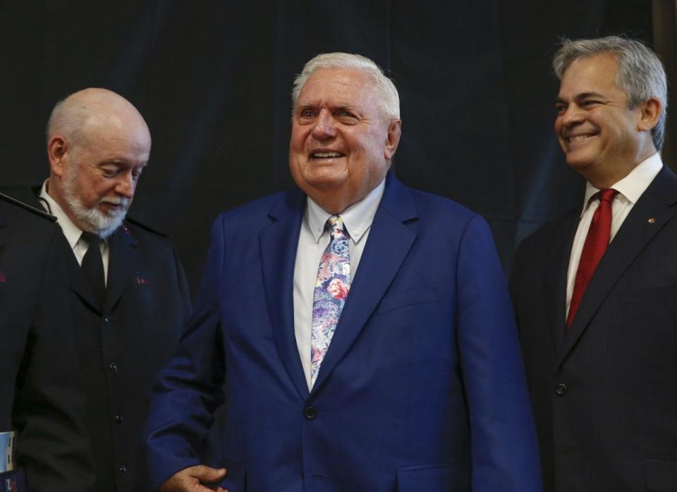 Dick Rathgeber, center, estimates that he's given $190 million to $200 million throughout his life