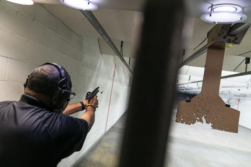Chad King, who started the Detroit chapter of the National African American Gun Association and teaches de-escalation training, practices at a shooting range in Taylor, Mich., Wed, Oct. 28, 2020. King started his group in 2017 to promote responsible gun ownership in the Black community. Now the nation is on edge contemplating the added threat of possible clashes in the wake of Election Day. Some of his students sought gun ownership as far right groups appear to them to have become more emboldened. Weeks ago, a group of white men were arrested for allegedly plotting to kidnap the Democratic governor of Michigan. Trump has refused to promise a peaceful transfer of power. He told a far-right group to “stand back and stand by.” (AP Photo/David Goldman)