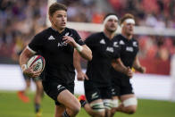 New Zealand's Beauden Barrett, left, runs in to score a try during the rugby international between the All Blacks and the USA Eagles at FedEx Field in Landover, Md., Saturday, Oct. 23, 2021. (AP Photo/Alex Brandon)