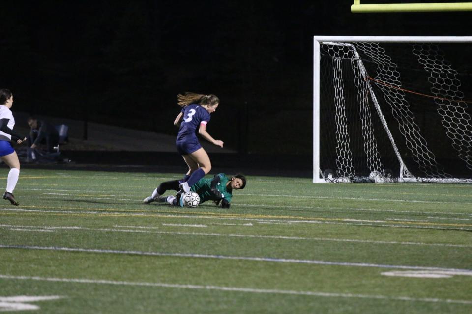 Perry attempts to stop a Des Moines Christian goal in the first half against Des Moines Christian on Monday, March 25, 2024.