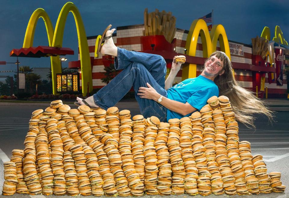 Donald Gorske atop a pile of Bic Macs