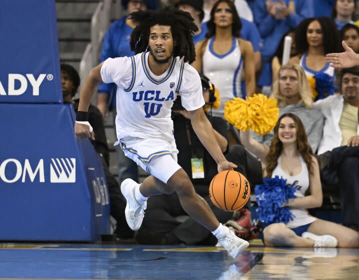 UCLA guard Tyger Campbell brings the ball up the floor while playing Oregon during the second half.