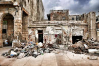 <p>Debris is piled up at Havana’s Malecon waterfront, three days after Hurricane Irma passed over Cuba, on September 12, 2017, in Havana, Cuba. (Photo: Sven Creutzmann/Mambo photo/Getty Images) </p>