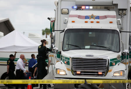Investigators work the scene of a fatal workplace shooting in Orlando, Florida, U.S. June 5, 2017. REUTERS/Daniel LeClair