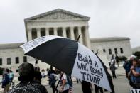 Protestors demonstrate outside the U.S. Supreme Court after U.S President Donald Trump announced U.S. Court of Appeals Judge Amy Coney Barrett as his nominee to fill the Supreme Court seat left vacant by the death of Justice Ruth Bader Ginsburg