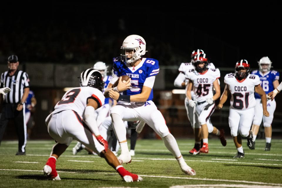 Arcadia quarterback Braylen Rooney (5) runs with the ball against Coconino at Arcadia High School on Sept. 15, 2023.