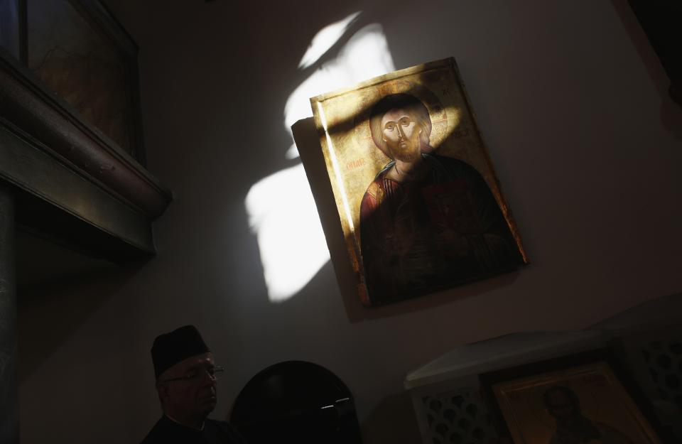 An Orthodox priest attends Christmas mass at Greek Orthodox patriarchal Cathedral of St. George in Istanbul