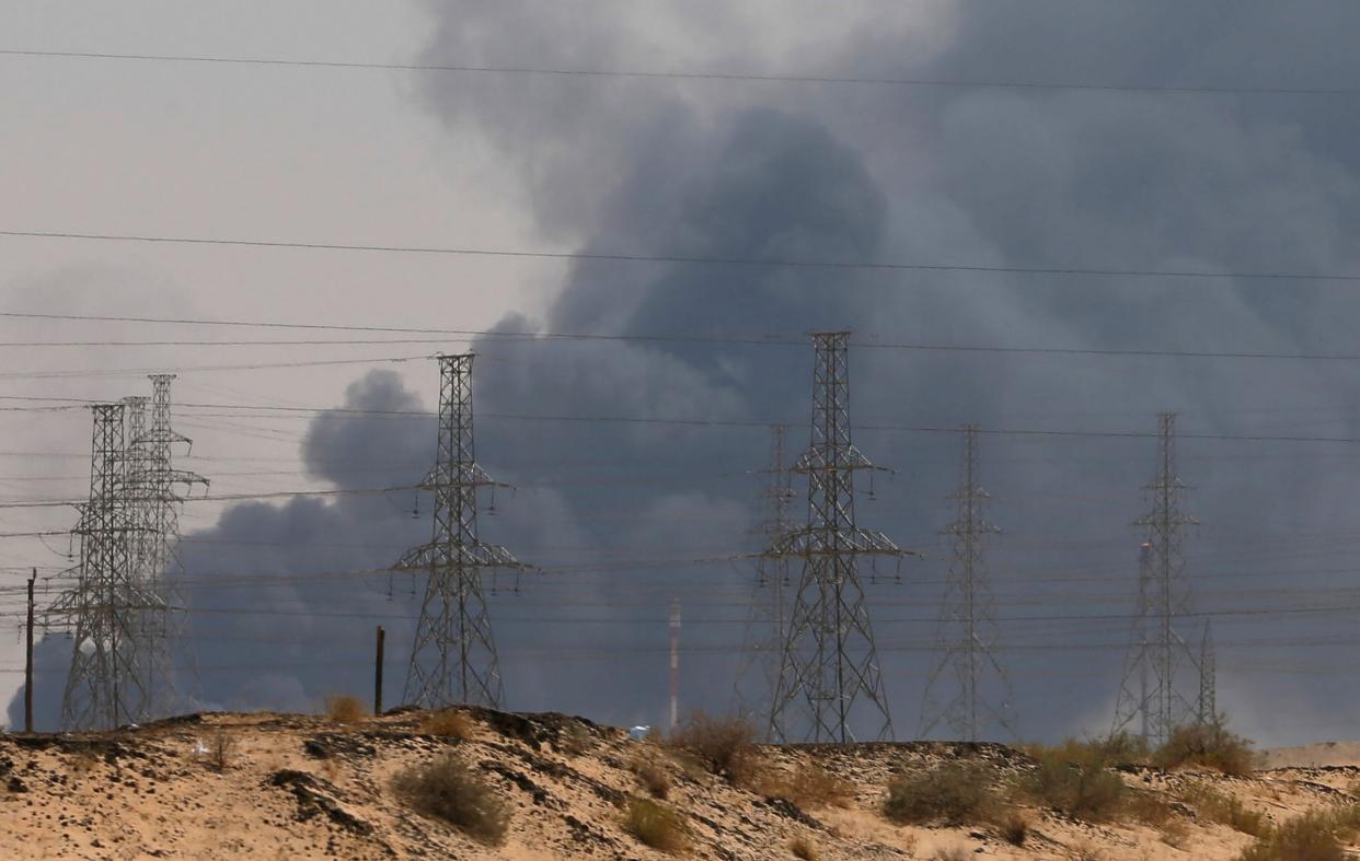 Smoke is seen following a fire at an Aramco factory in Abqaiq, Saudi Arabia: REUTERS