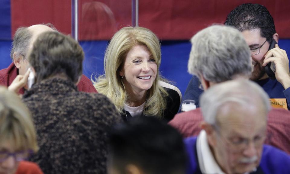 Texas Sen. Wendy Davis, D-Fort Worth, visits with volunteers manning a call center at her campaign headquarters, Tuesday, March 4, 2014, in Fort Worth, Texas. Texas is holding the nation's first primary election Tuesday with a political free-for-all in Republican races that could push the state further right, though Democrats are calling it the next big electoral battleground with Davis running for governor. (AP Photo/LM Otero)