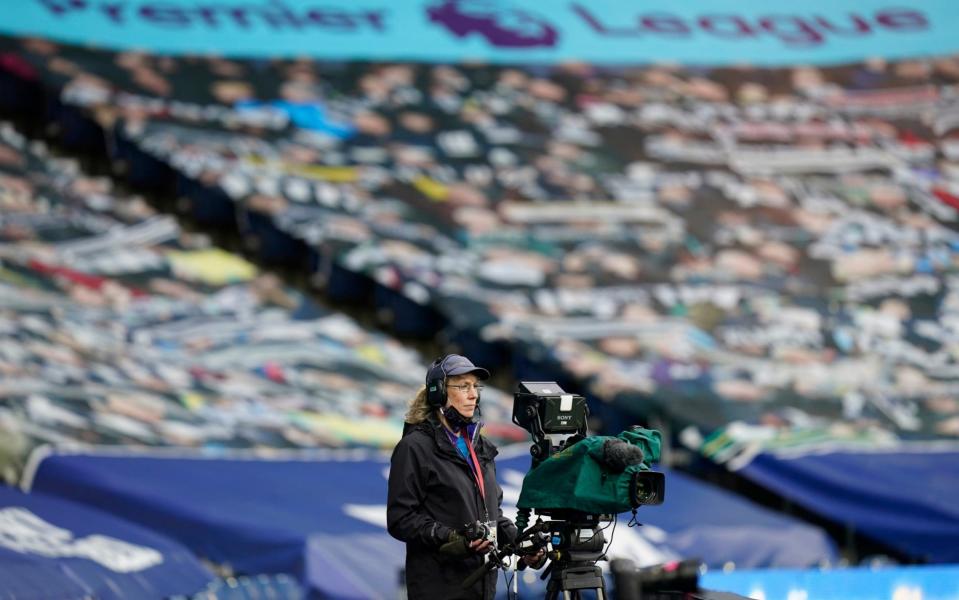  A camera operator looks on during the Premier League match between West Bromwich Albion and Burnley  - GETTY