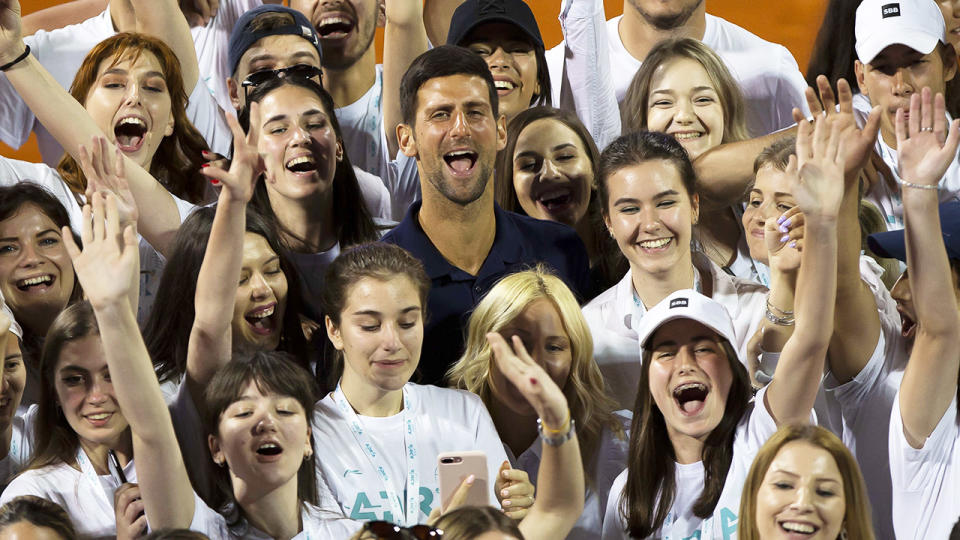 Novak Djokovic, pictured here with tournament volunteers at the Adria Tour in Serbia.