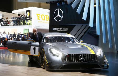 Daimler CEO Dieter Zetsche presents the new Mercedes-AMG GT3 race car during the first press day ahead of the 85th International Motor Show in Geneva March 3, 2015. REUTERS/Arnd Wiegmann