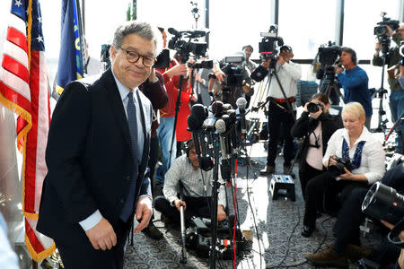 FILE PHOTO: U.S. Senator Al Franken leaves after speaking to the media outside his office on Capitol Hill in Washington, U.S., November 27, 2017. REUTERS/Yuri Gripas