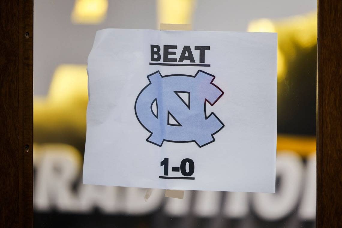 A beat UNC print out hangs near the Appalachian State players lounge at Kidd Brewer Stadium in Boone, N.C., Tuesday, Aug. 30, 2022.