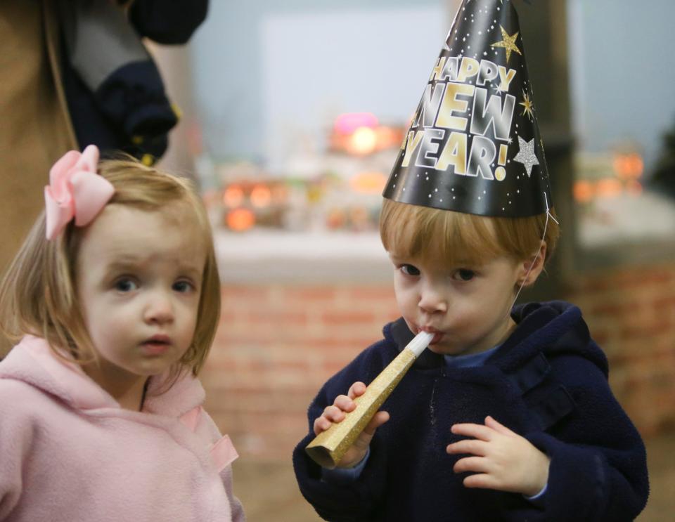 The Children's Hands-on Museum will have New Years for Kids on Dec. 30. In this Dec. 30, 2017 file photo, Charlie Ezell blows on a noise maker as he stands by his twin sister, Madge, during the New Year's Eve celebration at the Children's Hands-on Museum in downtown Tuscaloosa.