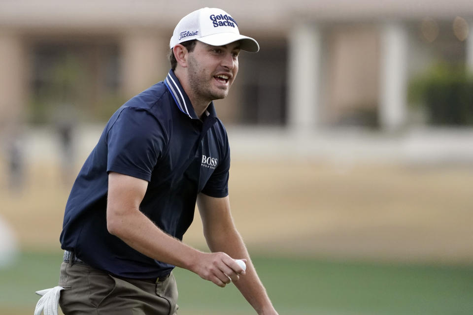 Patrick Cantlay acknowledges the gallery on the ninth hole after finishing the second round of the American Express golf tournament on the Nicklaus Tournament Course at PGA West on Friday, Jan. 21, 2022, in La Quinta, Calif. (AP Photo/Marcio Jose Sanchez)