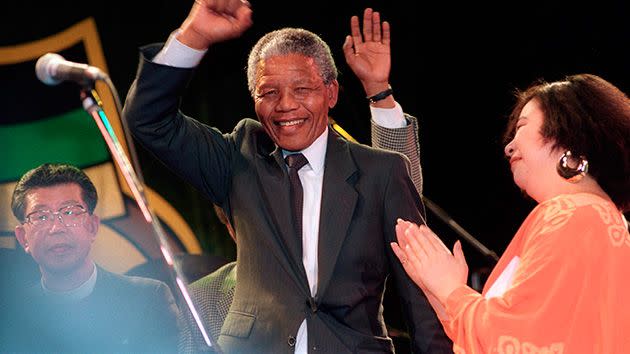 Nelson Mandela responds to the crowd and singers applauding him, after the song 