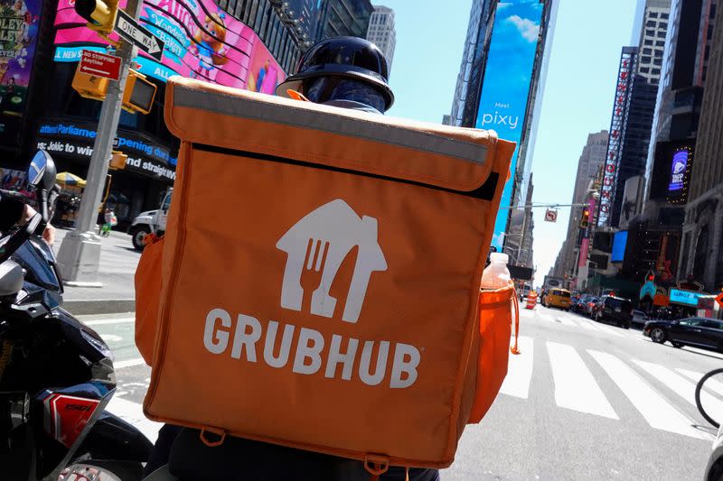 FILE PHOTO: FILE PHOTO: A Grubhub delivery person rides in Manhattan, New York City