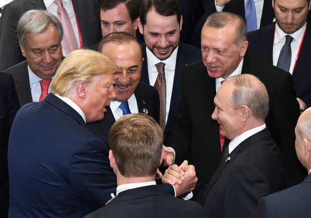 U.S. President Donald Trump, left, shakes hands with Russian President Vladimir Putin, right, as Turkey's President Recep Tayyip Erdogan, 2nd right and United Nations Secretary-General Antonio Guterres, left, look on, on the sidelines of the G-20 summit in Osaka, Japan, Saturday, June 29, 2019. (Presidential Press Service/Pool Photo via AP) (Photo: via Associated Press)