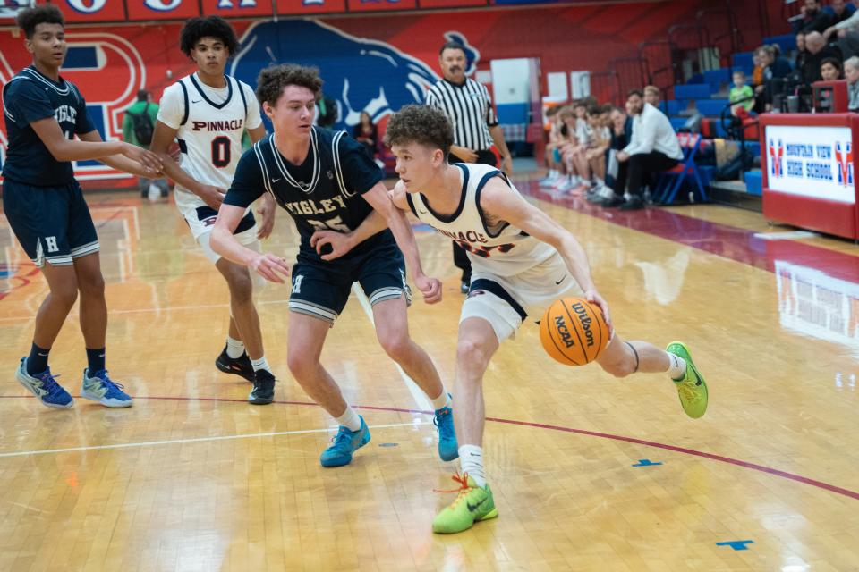 Dec 19, 2022; Mesa, AZ, USA; Pinnacle's Ashton Reese (24) drives around Higley's Brock Seiber (25) in their Visit Mesa Basketball Challenge first-round match at Mountain View High School on Dec. 19, 2022, in Mesa.