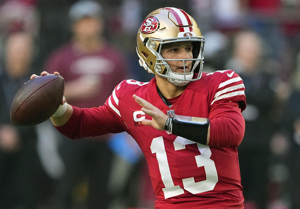 FILE - San Francisco 49ers quarterback Brock Purdy (13) throws against the Arizona Cardinals during the first half of an NFL football game, Sunday, Dec. 17, 2023, in Glendale, Ariz. Brock Purdy is a finalist for The Associated Press 2023 NFL Most Valuable Player award. The winners will be announced at NFL Honors on Feb. 8.(AP Photo/Matt York, File)