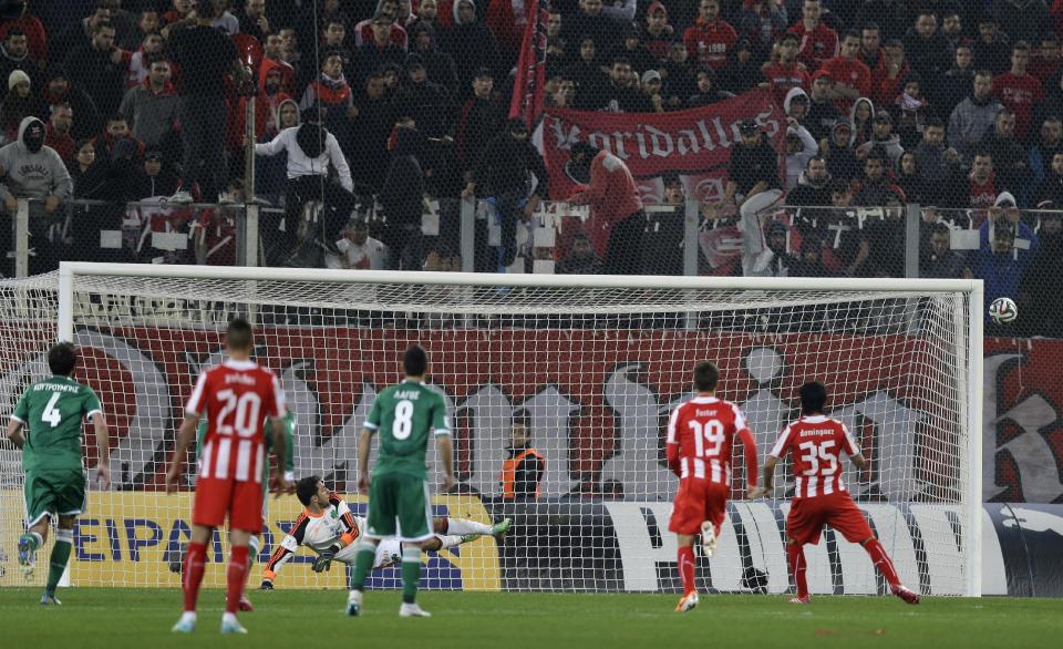 Olympiakos' Alejandro Dominguez, 35, misses the goal with a penalty against Panathinaikos during a Greek League soccer match at Georgios Karaiskakis stadium, in Piraeus port, near Athens, on Sunday, March 2, 2014. (AP Photo/Thanassis Stavrakis)