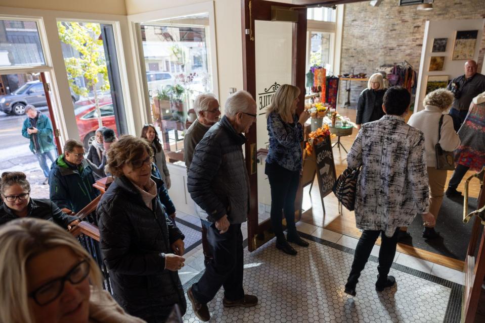 Attendees of the Mercantile Plaza grand opening enter the gallery common area Wednesday, Nov. 1.