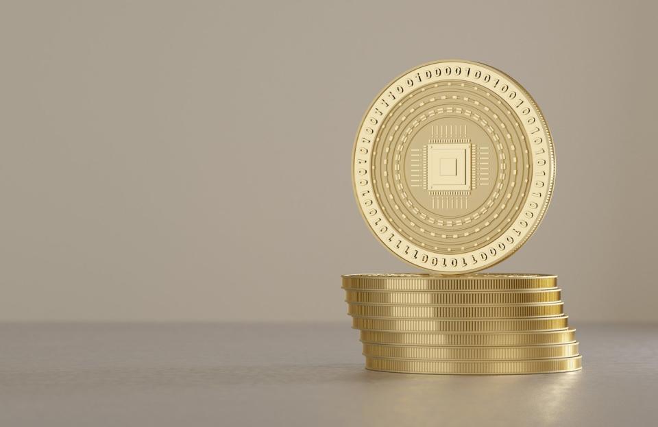 Stack of gold cryptocurrency coins.