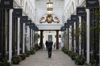 A man walks through a sparsely populated arcade in Covent Garden in London
