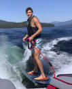 In this photo provided by Stacy Chapin, Ethan Chapin surfs on Priest Lake in northern Idaho in this family snapshot from July 2022. Chapin was one of four University of Idaho students found stabbed to death in a home near the Moscow, Idaho campus on Sunday, Nov. 13, 2022. Police are still searching for a suspect in the case. (Stacy Chapin via AP)