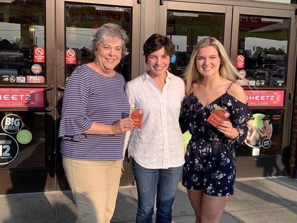 Executive Emily Sheetz (C) gave Sherry Allgood (L) and Devin Bennett (R), a year's worth of gas after their chance meeting at a Sheetz pump. (Photo: Sheetz)