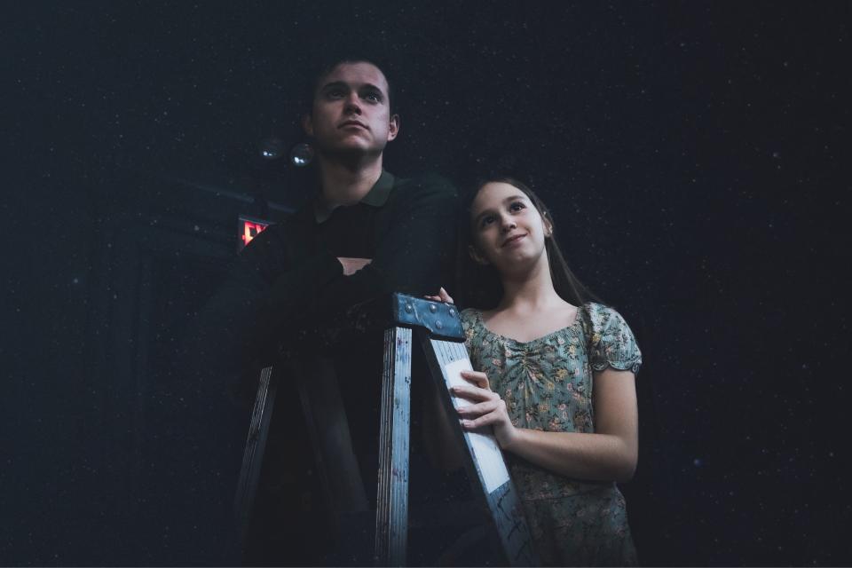 George Gibbs, played by Kenney Bennell, with his sister Rebecca,  played by Abiageal Murphy, as they study the moon.