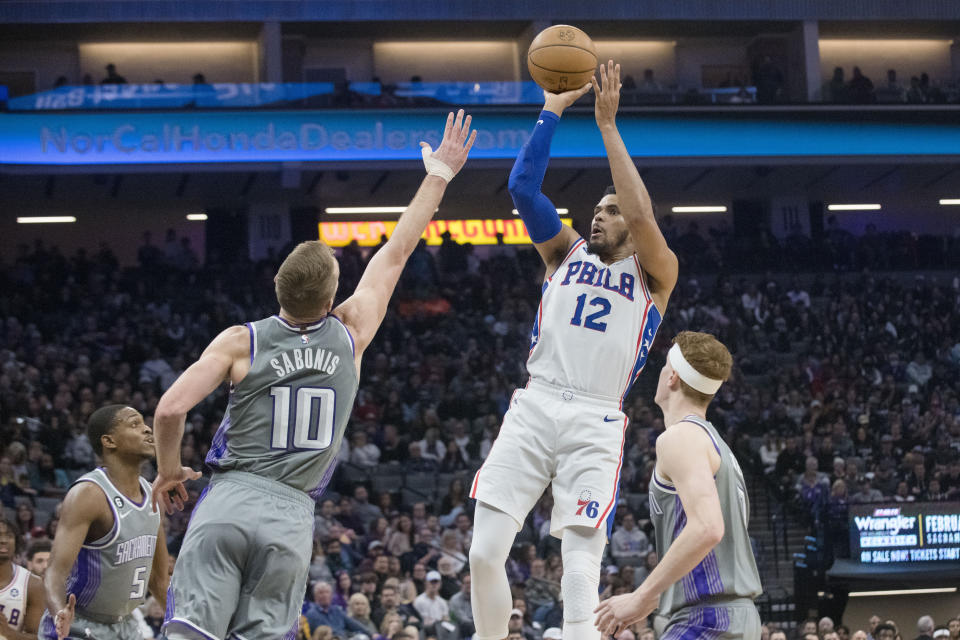 Philadelphia 76ers forward Tobias Harris (12) shoots over Sacramento Kings forward Domantas Sabonis (10) during the first quarter of an NBA basketball game in Sacramento, Calif., Saturday, Jan. 21, 2023. (AP Photo/Randall Benton)