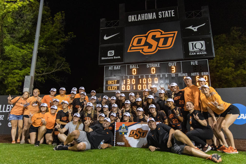 The Oklahoma State Cowgirls celebrate their 5-1 victory against the Clemson Tigers on Friday night to clinch a trip to the WCWS.