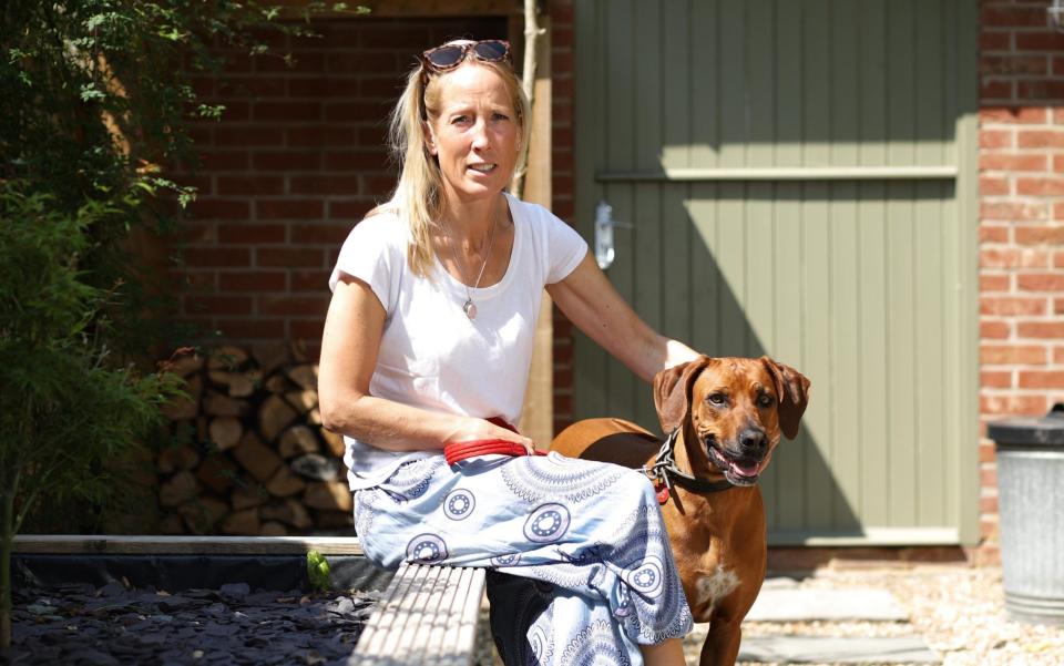 Abigail Butcher photographed with her dog Thala at their home in Lymington, Hampshire - John Lawrence 