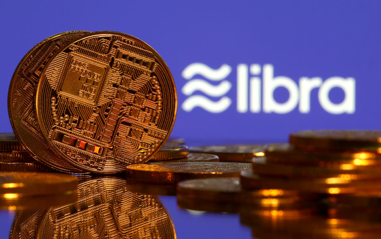 Representations of virtual currency are displayed in front of the Libra logo in this illustration picture, June 21, 2019. REUTERS/Dado Ruvic/Illustration