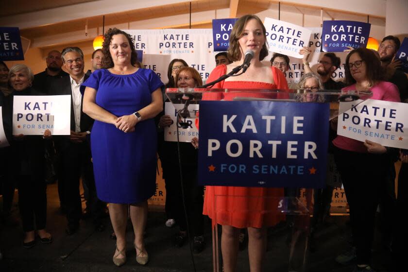 LONG BEACH, CA - MARCH 5, 2024 - - U.S. Representative Katie Porter applauds her daughter Betsy Hoffman, 12, off camera, while she introduces her mother to supporters at Porter's watch party at The Bungalow in Long Beach on March 5, 2024. (Genaro Molina/Los Angeles Times)