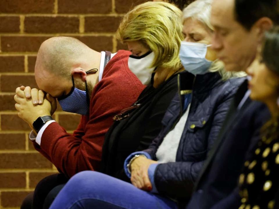 A man prays as people attend a mass in memory of Conservative British lawmaker David Amess, who was fatally stabbed in southeast England on Friday. (Tolga Akmen/AFP/Getty Images - image credit)