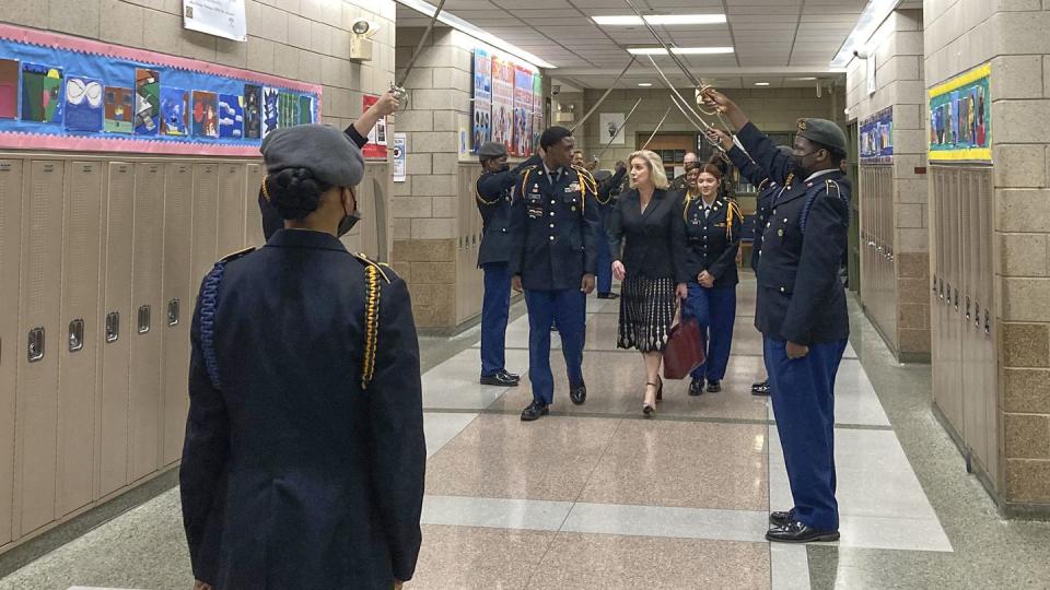 Army Secretary Christine Wormuth is greeted at the Chicago Military Academy as she heads into meetings with young members of the Reserve Officers' Training Corps in Chicago on Feb. 15. (Lolita Baldor/AP)