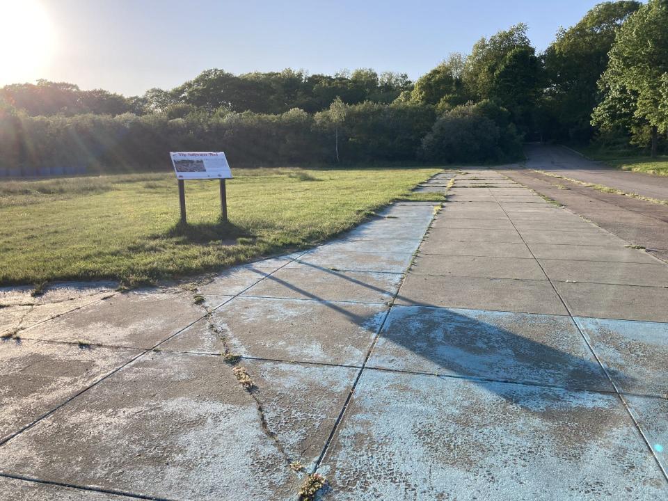 The saltwater pool at Rocky Point State Park has been filled in. A sign at the site provides information about its history.