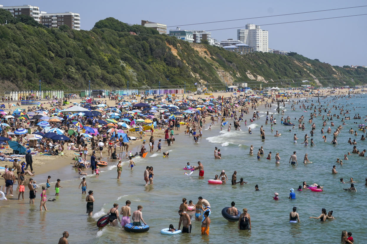 People on the beach in Bournemouth. Britons are set to melt on the hottest UK day on record as temperatures are predicted to hit 40C. Picture date: Tuesday July 19, 2022.