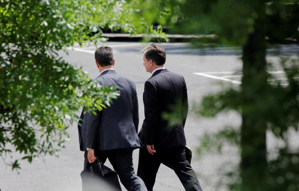 FBI Director Christopher Wray (right) arrives at the West Wing of the White House for a meeting with President Donald Trump on May 21, 2018. (Photo: Carlos Barria / Reuters)