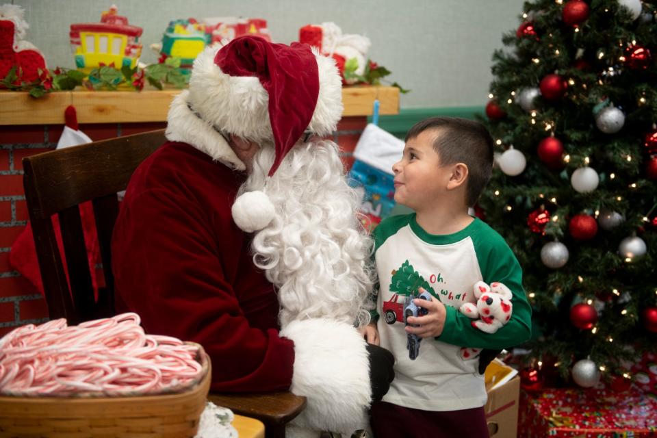 Louis Scott V chats with Santa at Freedom Town Hall in Freedom Township.