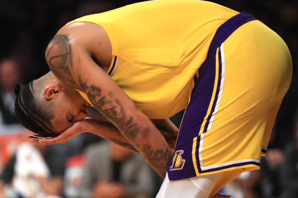 Lakers' Kyle Kuzma holds his eye after being poked by Thunder forward Darius Bazley during their game on Tuesday. (Sean M. Haffey/Getty Images)