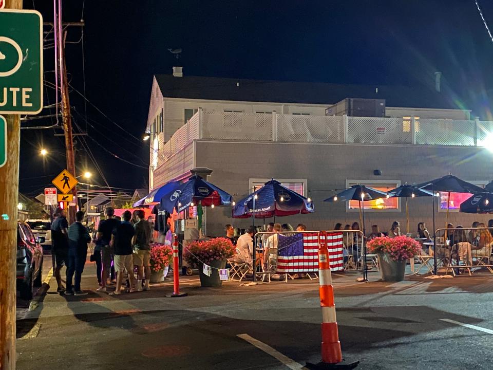 People gather at a restaurant Friday near Fairfield University in Connecticut.