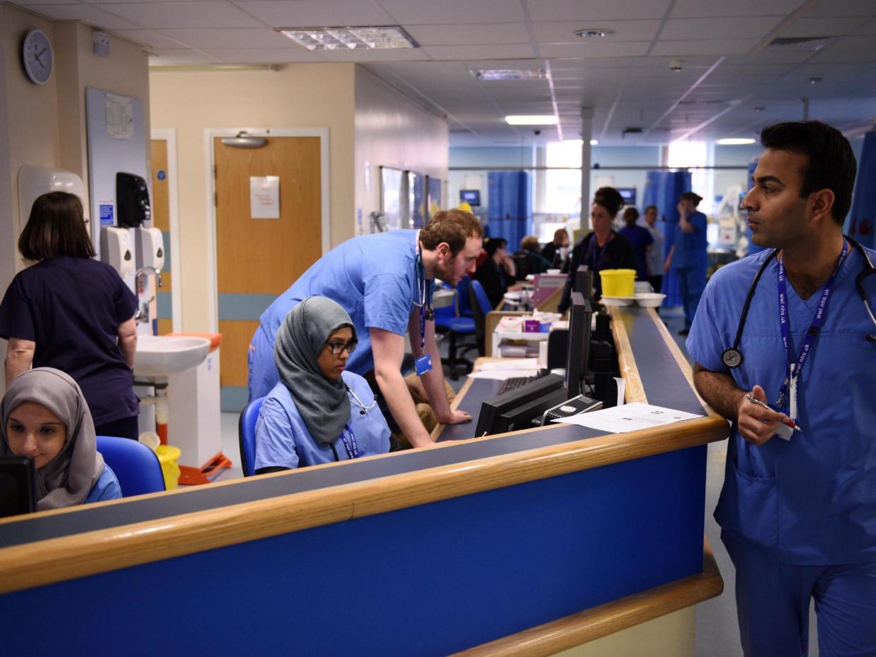 Clinical staff working in the Royal Albert Edward Infirmary's A&E department in 2015: AFP via Getty Images