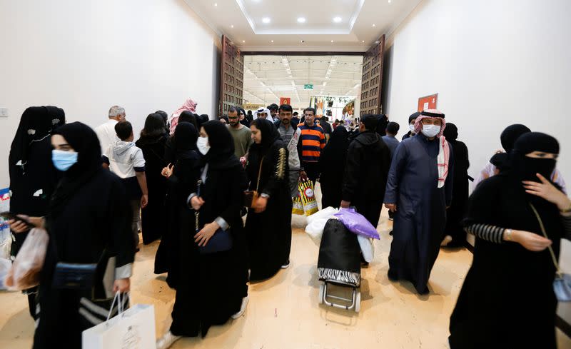 Locals wear face masks to take precautions from coronavirus, as they shop at the Bahrain's Autumn Fair 2020, in Manama