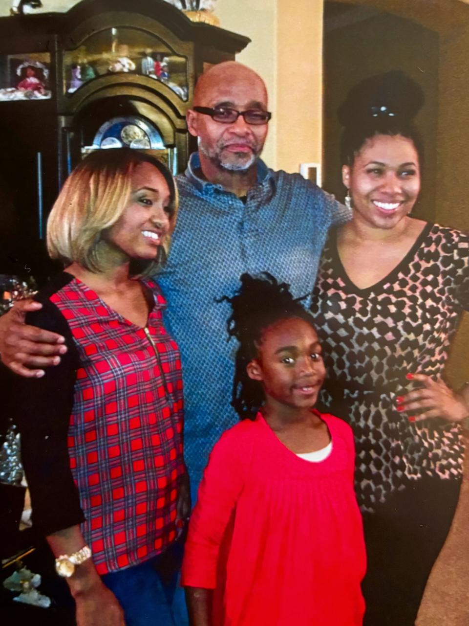 After DNA results prompted a Summit County judge to release Douglas Prade from prison in late 2012 for 18 months, he spent time with his family. To his right and left are his daughters Kenya and Sahara Prade. Granddaughter Keilyn Pittman is front and center.