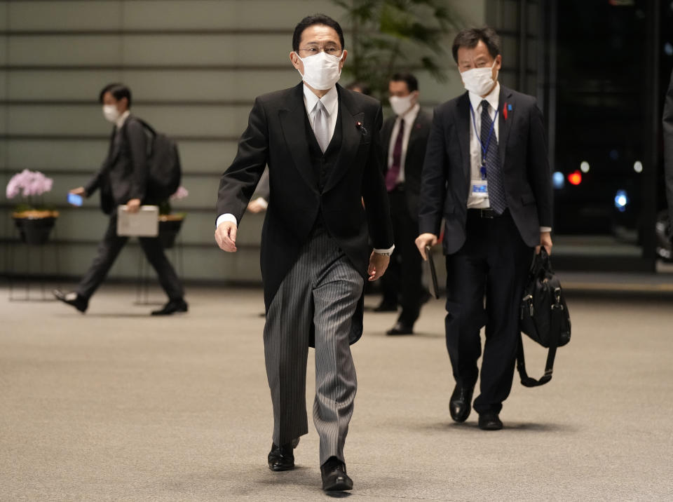 Japanese Prime Minister Fumio Kishida arrives at the prime minister's official residence after he and his ministers attended the attestation ceremony of his cabinet at the Imperial Palace Monday, Oct. 4, 2021, in Tokyo. Japan's parliament on Monday elected Kishida, a former moderate turned hawk, as prime minister. (AP Photo/Shuji Kajiyama)